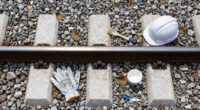Painting The Sides Of Railroad Rails White To Reduce Derailment
